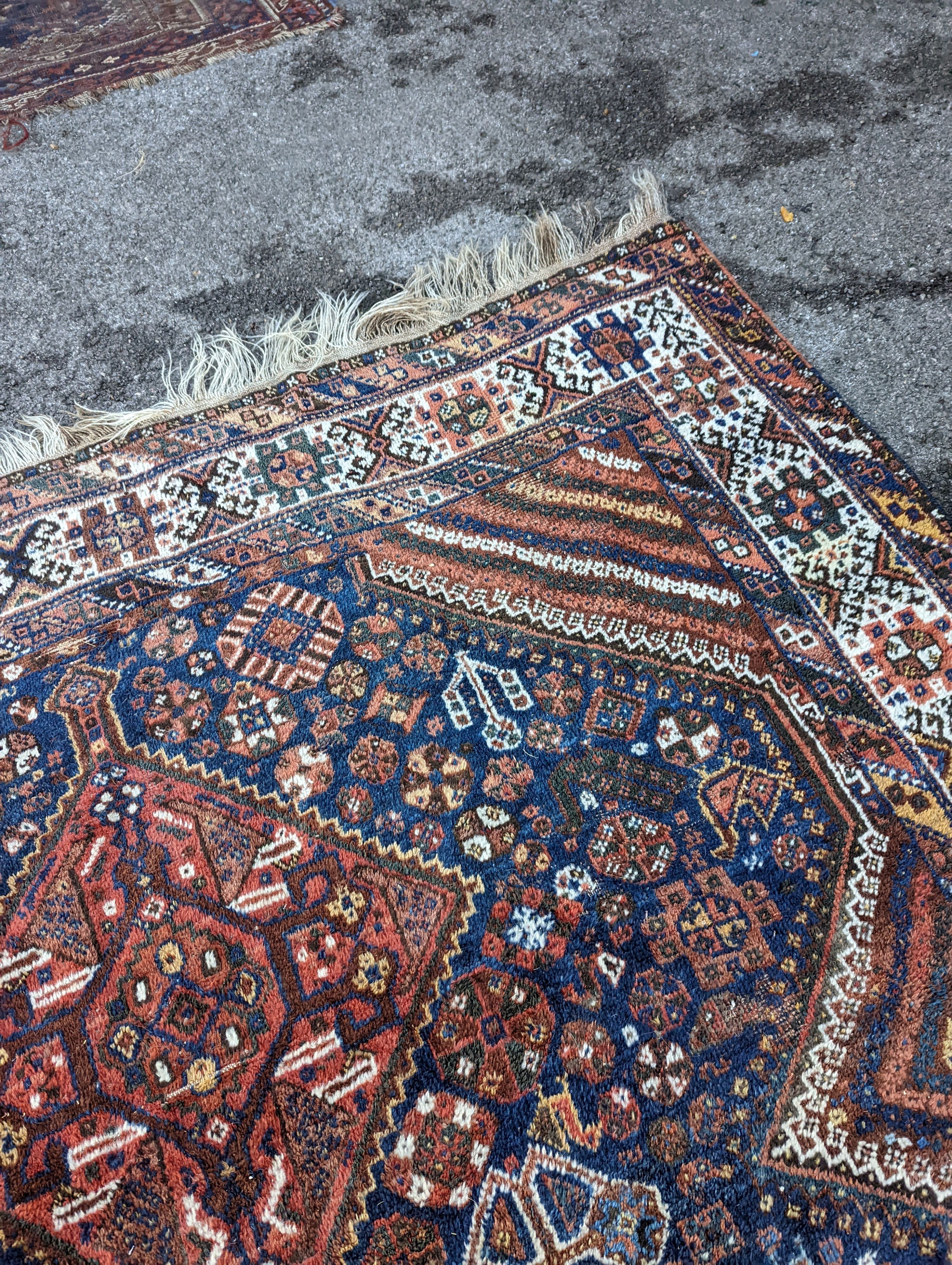 A Shirvan blue ground carpet, 315 x 222cm